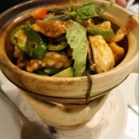 Seafood in Clay Pot · Prawns, Scallops, Calamari, Salmon and Mussels in a chili paste/garlic sauce served in a hot...