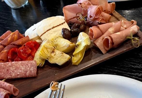 Antipasto · Fresh mozzarella, capicola, salami, Kalamata olives, artichoke hearts and roasted red peppers. On salad bed for an additional charge.