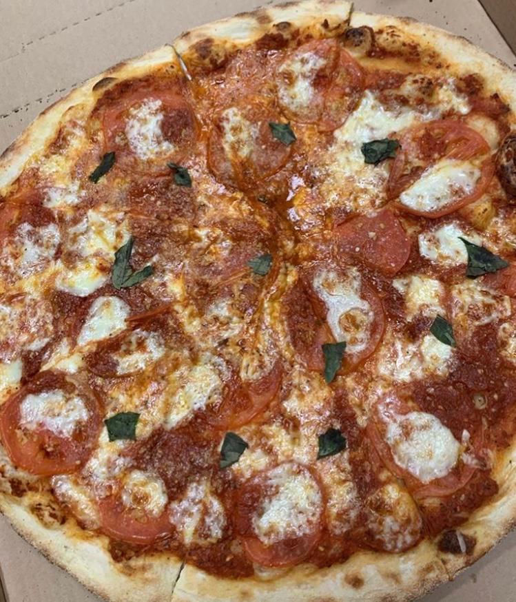 Mama’s Margherita Pizza · Tomato sauce, thin sliced tomatoes, fresh mozzarella, fresh basil, extra virgin olive oil.