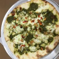 Paulie’s Pesto Chicken Pizza · Fresh basil pesto sauce, grilled chicken, sweet oven-roasted tomatoes and fresh mozzarella.