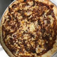 BBQ Chicken Pizza · B8Q sauce, chicken, red onions, bacon and cheddar.