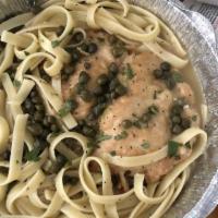 Chicken Piccatta · Chicken, cooked in tangy piccata sauce, with capers, Parmesan and parsley.