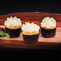 Vanilla Bean Mini Cupcakes · A 3-pack mini vanilla cupcakes topped with Tahitian vanilla bean icing and white chocolate c...