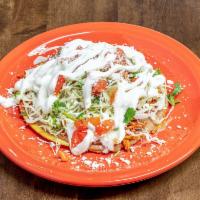2 Tostadas con Carne · Meat of choice, beans, cabbage, pico de gallo, Cotija cheese, and sour cream.