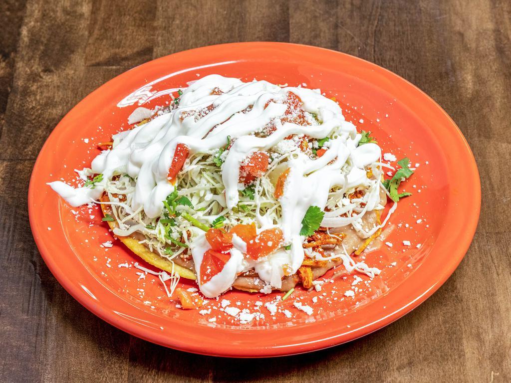 2 Tostadas con Carne · Meat of choice, beans, cabbage, pico de gallo, Cotija cheese, and sour cream.