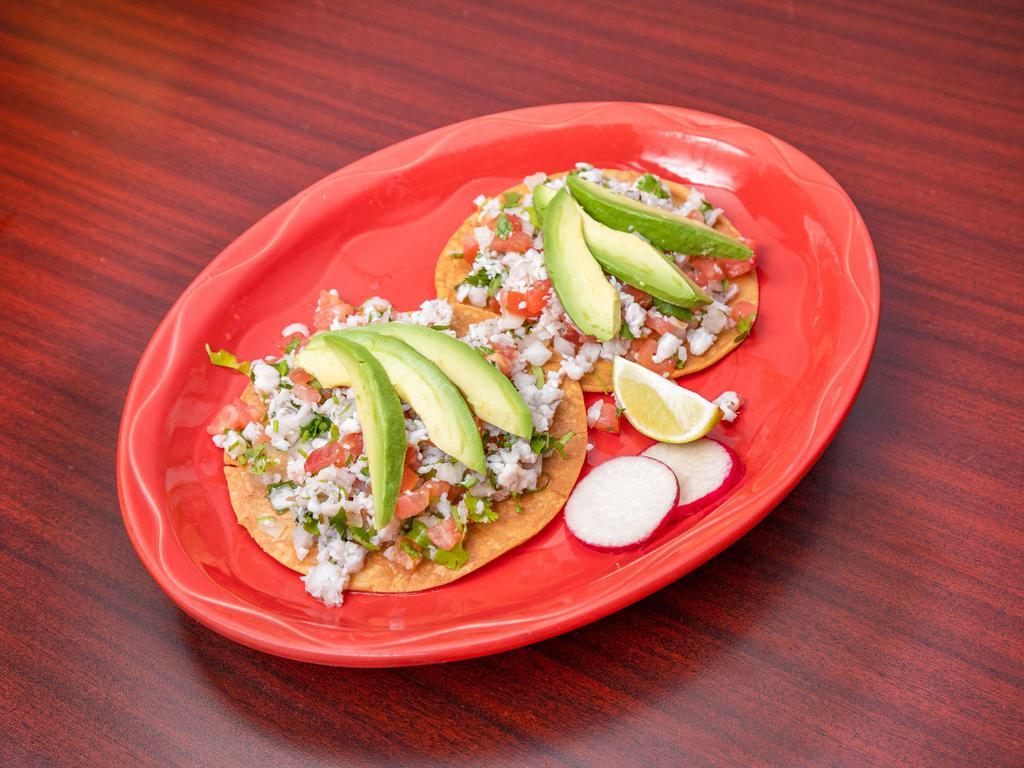 Orden de Ceviche de Camaron · Raw shrimp marinated in lime juice and mixed with pico de gallo, served with tostadas and avocado on the side.