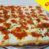 Our Famous Grandma's Square Pie · Large square pie baked in stone oven. Made with fresh mozzarella, home made pesto and marina...