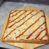 Sicilian Square Pizza · Baked in stone oven with fresh mozzarella, basil and our homemade marinara sauce.