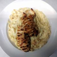 Leona's Classic Fettuccine Alfredo · Imported fettuccine noodles and our homemade Alfredo sauce. Served with a warm signature Ita...