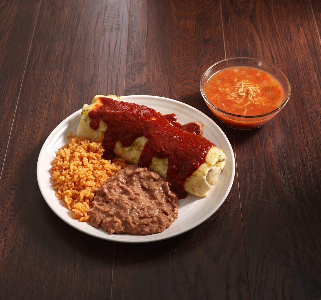 Al Pastor Burrito · Carnitas marinated in a chile guajillo pastor style sauce with fresh diced onion and cilantro topped with more sauce and melted Monterey cheese. 1 lb. burrito with sauce and melted monterrey cheese. Served with sopa de fideos, rice and refried beans.