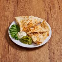 Chicken Quesadilla · 2 flour tortillas with grilled chicken, mozzarella cheese, sauted mushrooms and jalapeno pep...
