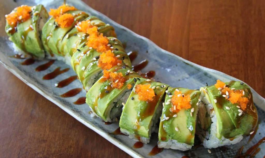 Caterpillar Roll · Imitation crab, cucumber, avocado, sushi rice, nori, sesame seed, avocado, masago, eel sauce on top.