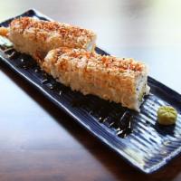 Geisha · Tempura shrimp, cream cheese, avocado, sushi rice, nori, with imitation crab, eel sauce on t...