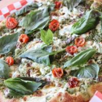 21. Pesto Marghetita Pizza · Pesto sauce, fresh sliced mozzarella cheese, onions, olive oil, tomatoes, topped with basil ...
