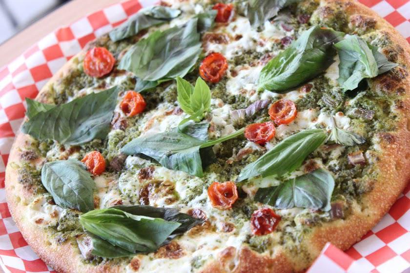 21. Pesto Marghetita Pizza · Pesto sauce, fresh sliced mozzarella cheese, onions, olive oil, tomatoes, topped with basil and lemon juice.