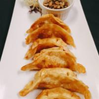Pot Stickers · Steamed and pan-seared pork dumplings served with a ginger sweet soy sauce.