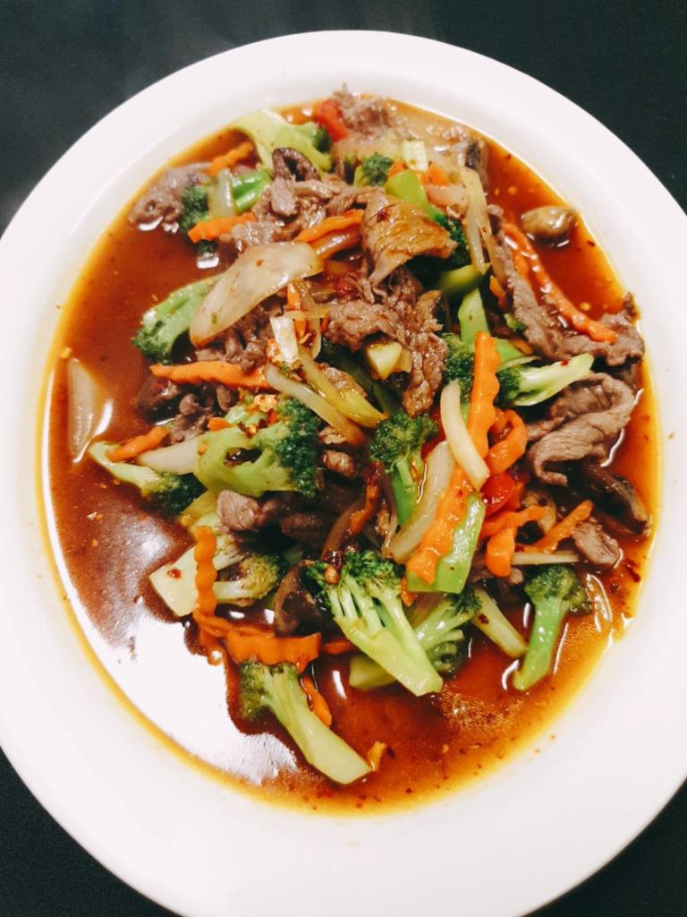 Mongolian Beef · Stir-fried beef with chili paste, bell pepper, onion, carrot and mushroom.