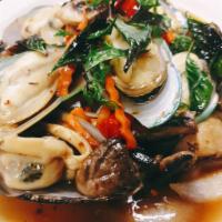 Spicy Mussels · Thai style. Delicious green mussels, sauteed in spicy garlic with basil, mushrooms, onions, ...