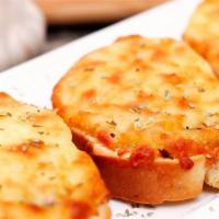 Cheese Garlic Bread · Topped with melted cheese, then finished with a buttery garlic blend and grated Parmesan. In...