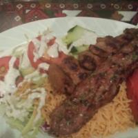 Sultani Kebab · Spiced ground beef, fresh scallion, tomato and chunks of marinated beef, broiled over wood c...