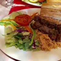Lamb Shish Kebab · Chunks of tender leg of lamb marinated with grated seasonings, broiled with onions and peppe...