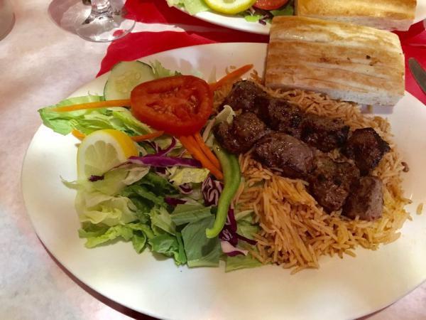 Lamb Shish Kebab · Chunks of tender leg of lamb marinated with grated seasonings, broiled with onions and peppers, served with brown rice and salad.