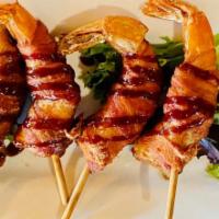 Bacon Wrapped Prawns · Charmoula marinated prawns served w/serrano aioli
