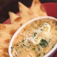 Dungeness Crab Dip · Fresh crab, & artichoke hearts w/a blend of melted cheeses. Served w/house made crackers