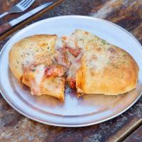 Meatball Roll · Meatballs, marinara and mozzarella. Dough may soften during delivery. We recommend reheating...