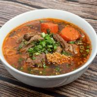 Beef Stew Noodle Soup  · Hearty soup with beef tendon and carrots.