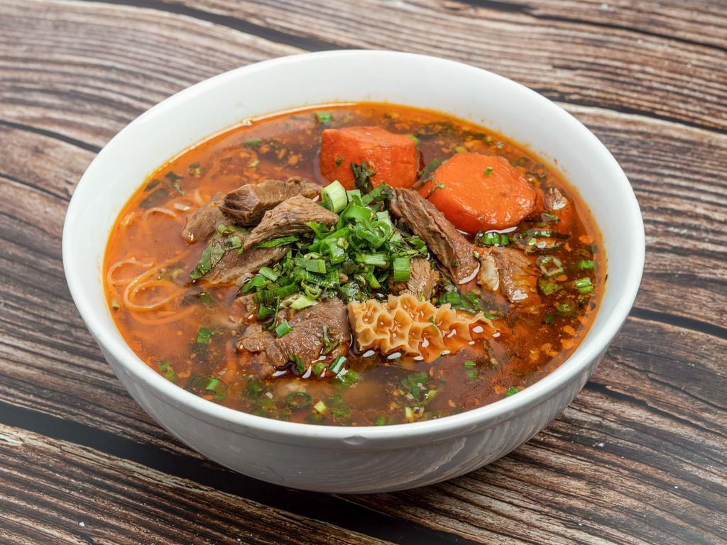 Beef Stew Noodle Soup  · Hearty soup with beef tendon and carrots.
