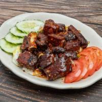 Spicy Ribs  · Short ribs topped with a sweet and spicy sauce.