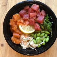 Ocean Pokè (Ahi Tuna and Salmon) · Poke bowl made with tuna, salmon, soy sauce, sea salt, green onions, edamame, kani salad, an...