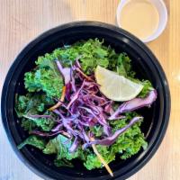 Kale Salad · Kale, baby spinach, shredded purple cabbage and carrots.