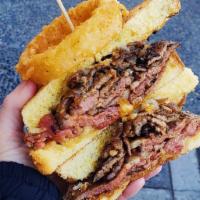 Sliced Steak Sandwich w/ Seasoned Fries · Baguette/ Caramelized Onions / Horseradish Aioli
