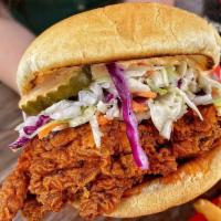 Fried Nashville Hot Chicken Sandwich · House slaw / house made fiery hot sauce / pickles / brioche bun / seasoned Fries