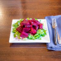 Beets Salad · Boiled beets soaked in oil and vinegar over a bed of romaine. Gluten-free and vegan.
