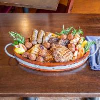 Meze Platter · An assortment of meats. Sausage, keftedes, chicken, and lamb souvlaki.