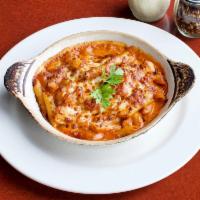 Penne Arrabbiata  · Penne pasta sauteed in a spicy marinara sauce topped with Parmesan cheese and fresh basil. A...
