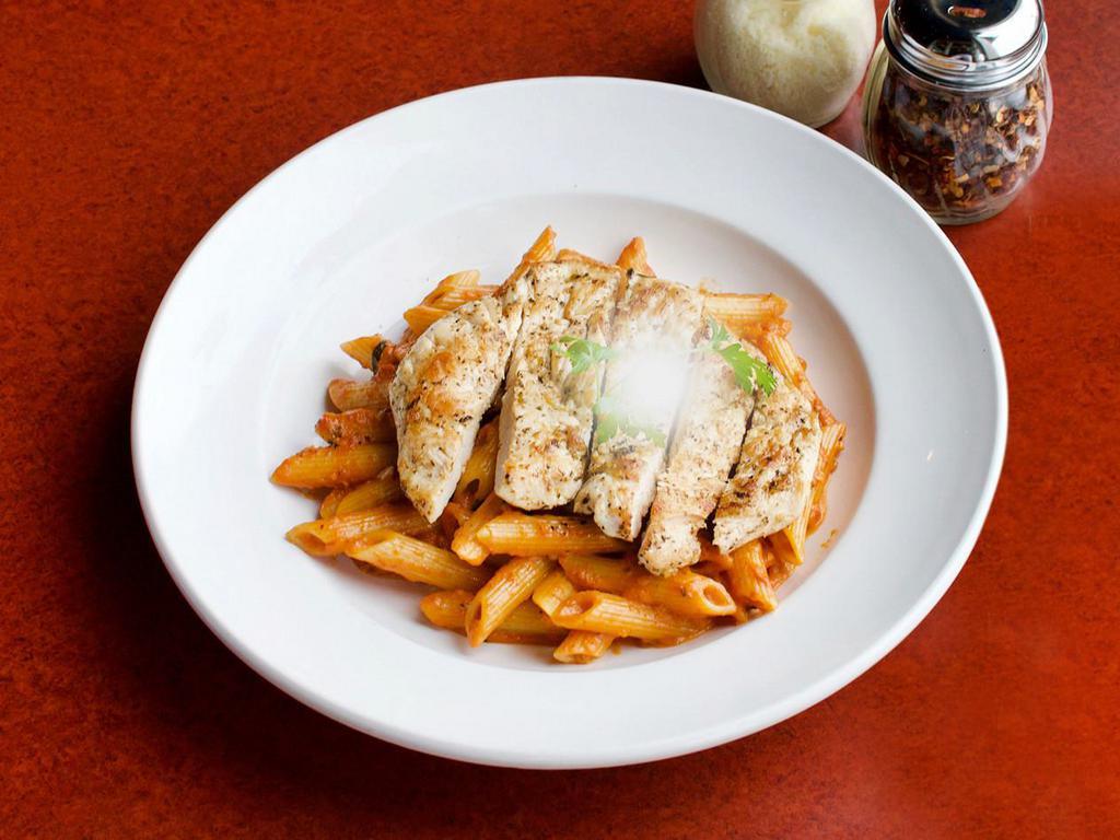 Penne Vodka Sauce · Penne pasta with prosciuttini in pink sauce, finished with vodka and topped with imported Parmigiano cheese. Add chicken, sausage or shrimp for an additional charge.