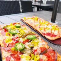 Pepper St. · All things pepper! Red sauce, cheese, pepperoni, chopped pepperoncini, sautéed peppers and j...