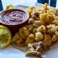 Fried Calamari · Breaded in our secret blend of flours and spices, served with zesty marinara sauce and lemon...