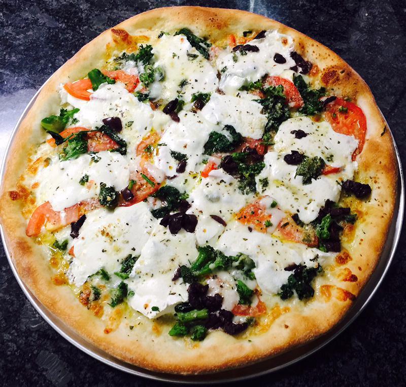 Paisano Pizza · Chopped tomatoes, fresh garlic, olive oil, basil, and mozzarella cheese.