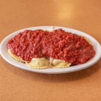 Ravioli · Pasta pillows stuffed with ricotta cheese or meat, topped with meat sauce or marinara.
