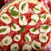 Margherita Pizza · Marinara sauce, fresh mozzarella, fresh basil and olive oil.