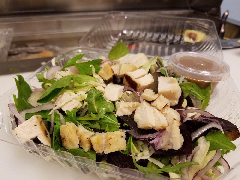 Asian Chicken Salad · Grilled chicken, peanuts, cabbage slaw, organic mixed greens, red onions, and house-made peanut dressing. Contains nuts.