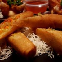Vegetarian Crispy Rolls · Fried spring rolls filled with celery, cabbage, carrot and silver noodles served with homema...