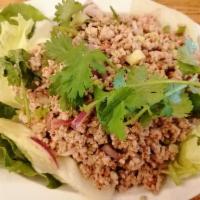 Larb Salad · Your choice of ground meat or tofu cooked with red and green onions, mint leaves, roasted ri...