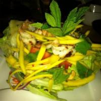 Mango Shrimp Salad · Grilled shrimp, sliced mango, red onion, mint, cilantro, lime leaf and cashews in lemongrass...
