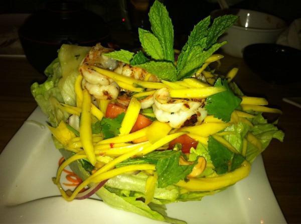 Mango Shrimp Salad · Grilled shrimp, sliced mango, red onion, mint, cilantro, lime leaf and cashews in lemongrass dressing.